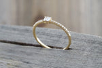 14kt Yellow Gold Round Brilliant And Baguette Cut Diamond Ring