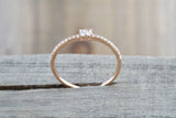 14kt Rose Gold Round Brilliant And Baguette Cut Diamond Ring